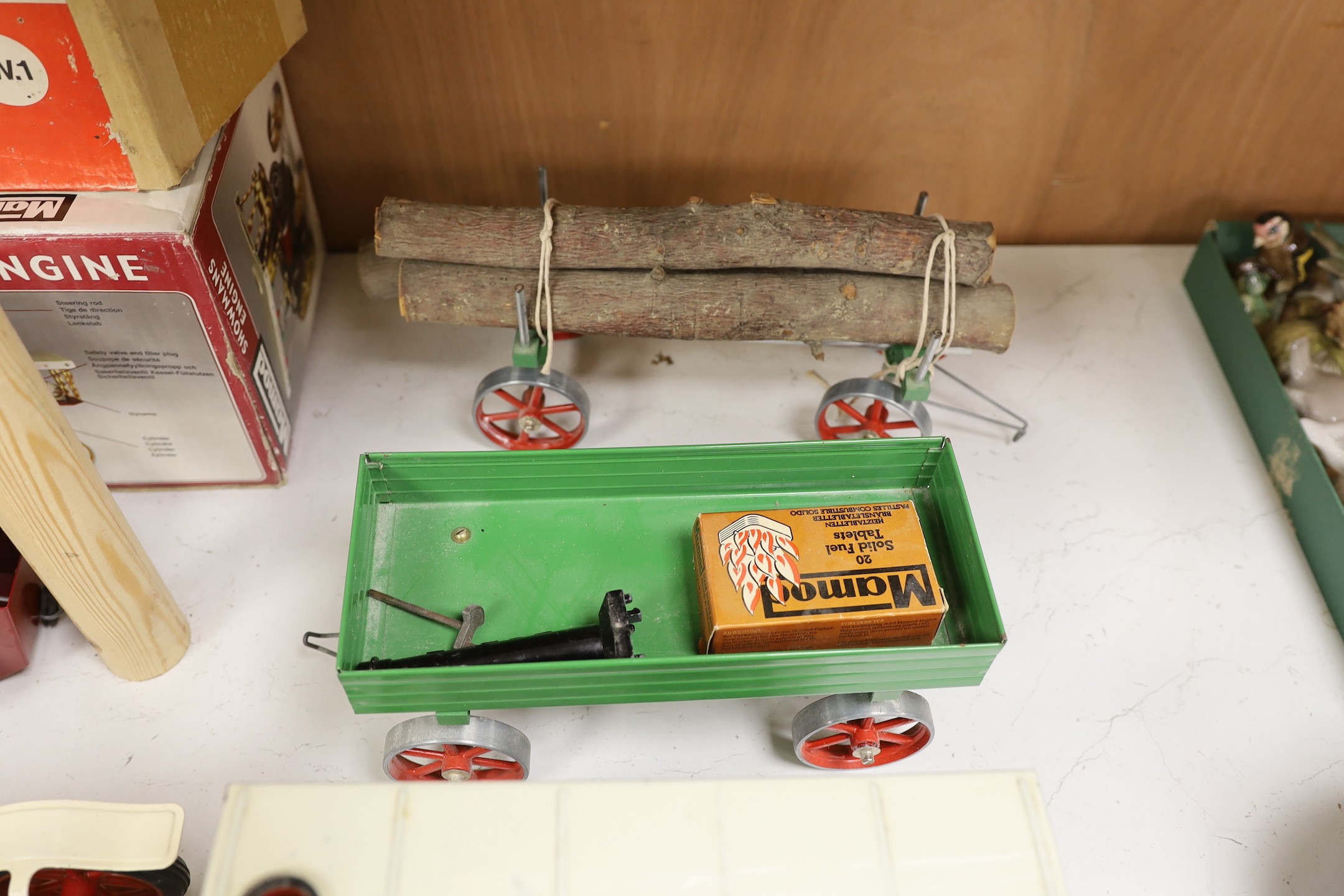 A boxed Mamod Showman's Engine and Lumbar wagon, and unboxed Steam Tractor and roadster- roadster 39 cms wide.